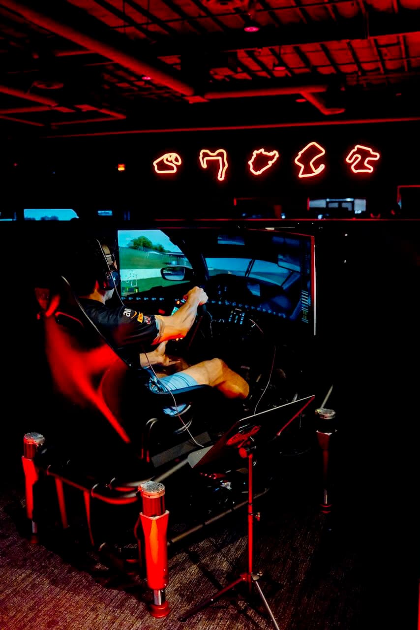 eSports sim rig on a full-motion base with a widescreen