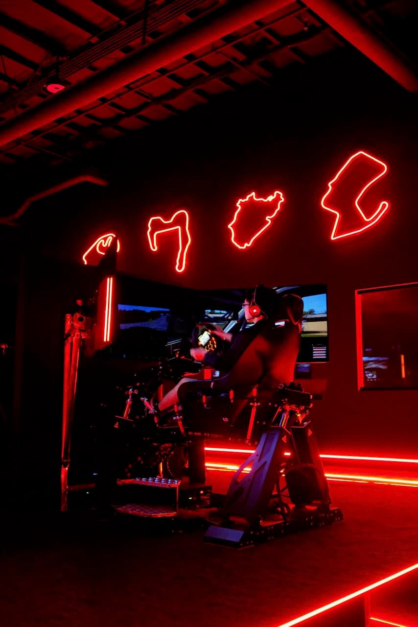 Pro sim rig on a full-motion base with three screens