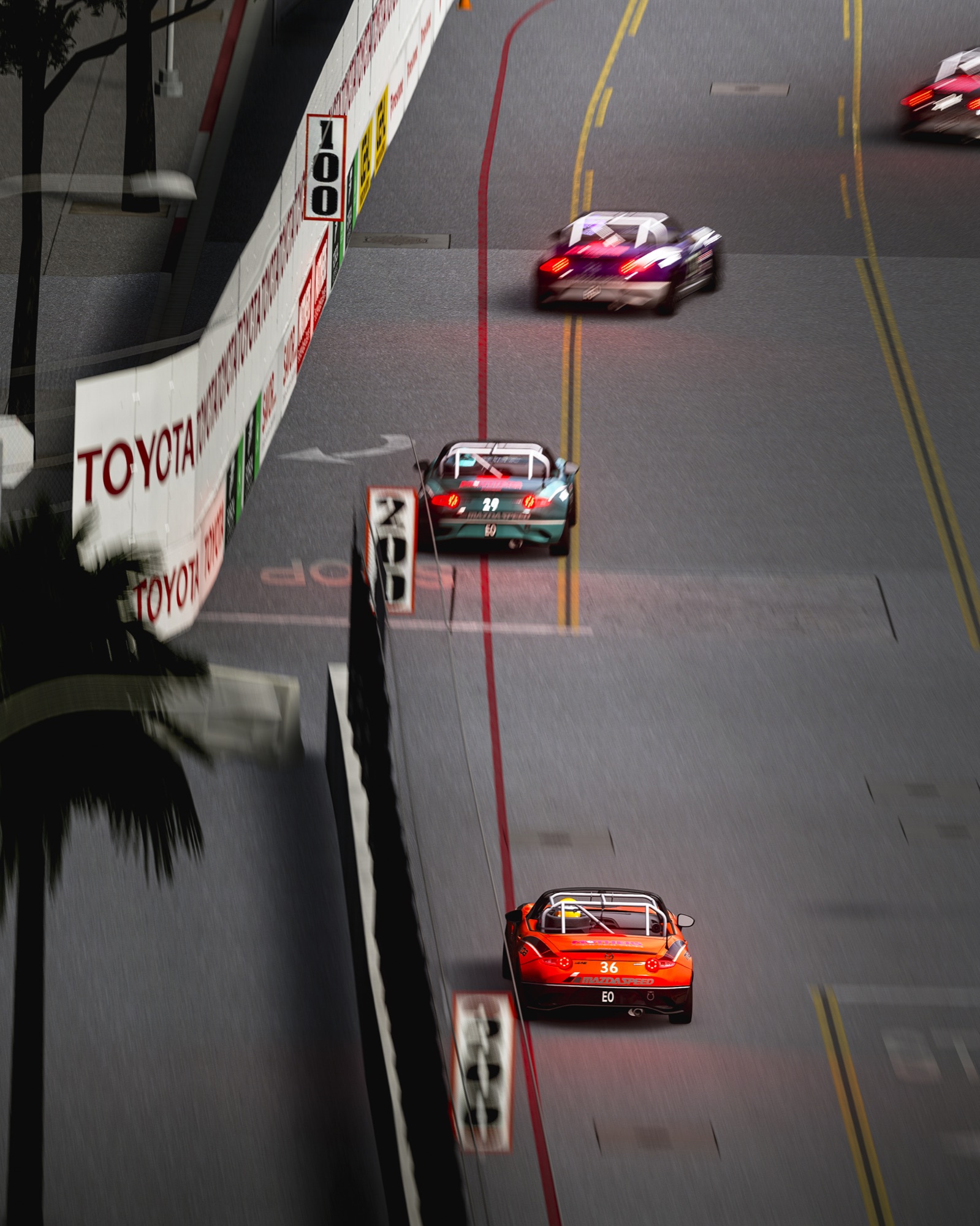 Field of MX-5 Cups streaming down Long Beach Shoreline Drive past palm trees